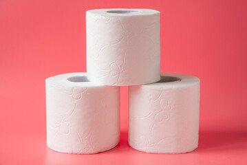 Toilet paper on pink background