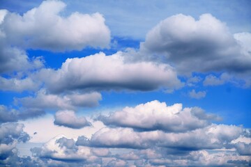 Blue sky background with large white clouds