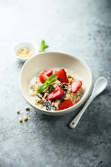 Healthy homemade muesli or oatmeal porridge with strawberry