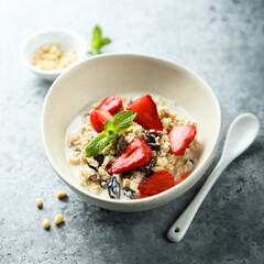 Healthy homemade muesli or oatmeal porridge with strawberry