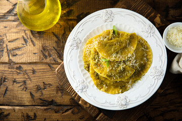Traditional homemade ravioli with pesto sauce