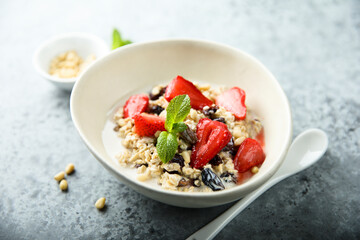 Healthy homemade muesli or oatmeal porridge with strawberry