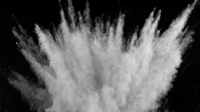 Super slow motion of white powder explosion isolated on black background. Speed ramp effect. Filmed on high speed cinema camera, 1000fps.