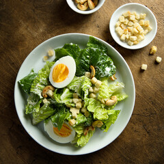 Healthy green salad with cashew and hard boiled eggs