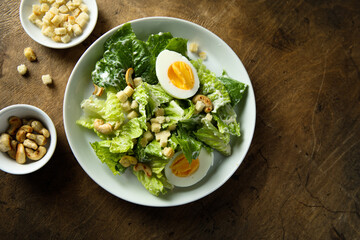 Healthy green salad with cashew and hard boiled eggs