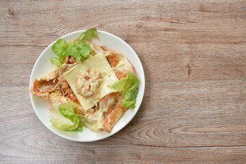 bread stuffed chicken and cheese with vegetable on plate