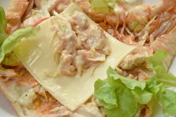 bread stuffed chicken and cheese with vegetable on plate