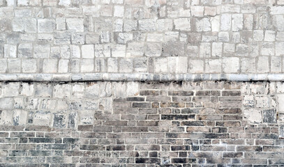 Half tile and half gray brick wall