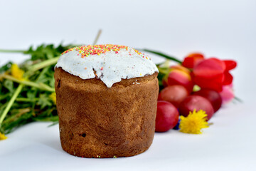 Easter cake and tulips on a white background.