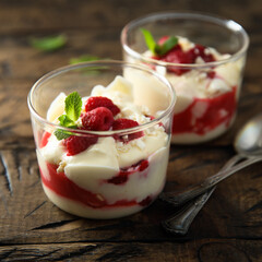 Homemade meringue trifle with custard and raspberries