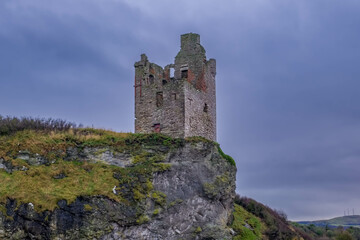 The Crumbling Ancient Ruins of Greenan Castle looking over From Greenan Bay in Ayrshire Scotland