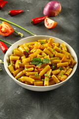 Bowl of healthy vegetarian meal- spicy cheese pasta penne.