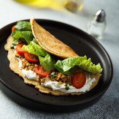 Pancake with olives and tomato