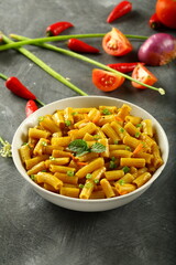 Bowl of healthy vegetarian meal- spicy cheese pasta penne.