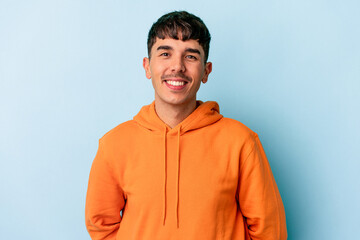 Young mixed race man isolated on blue background happy, smiling and cheerful.