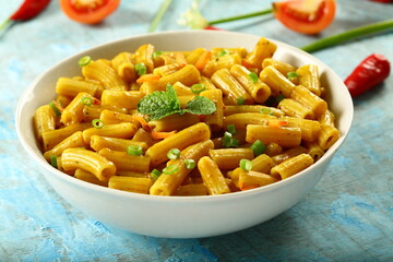 Bowl of healthy vegetarian meal- spicy cheese pasta penne.