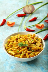 Bowl of healthy vegetarian meal- spicy cheese pasta penne.