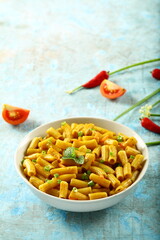 Bowl of healthy vegetarian meal- spicy cheese pasta penne.
