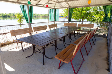 Simple gazebo for celebration with tables and seats