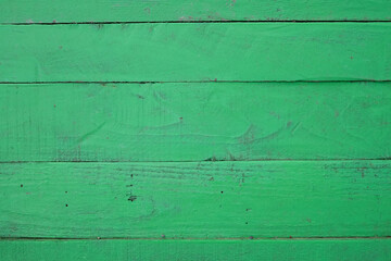 Wooden surface from boards painted green, background