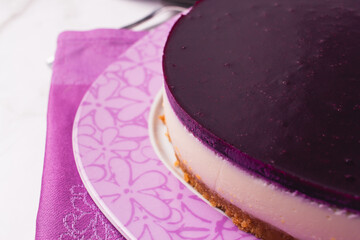 Cheesecake with berries coulis on top and selective focus.