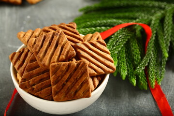 Christmas cookies served in white ceramic bowl. holidays background.