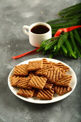 Delicious breakfast table setting- oven fresh chocolate cookies served with black coffee.