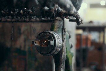 Spray gun for car painting with bokeh effect