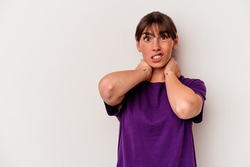 Young Argentinian woman isolated on white background touching back of head, thinking and making a choice.