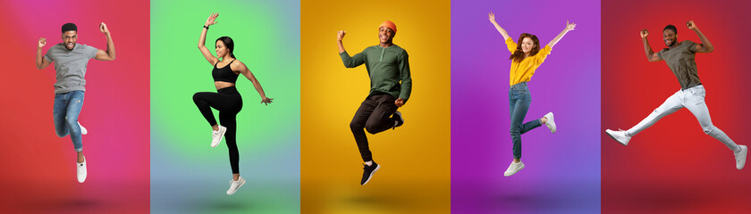 Carefree young diverse people jumping together, wearing casual outfits on colorful neon studio...