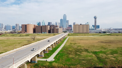 Top view running vehicles along Commerce Street Bridge toward Downtown Dallas Texas, USA in an...