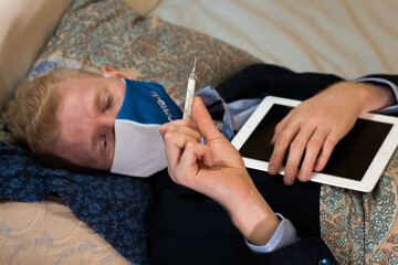 Covid-19. The man has an illness and works at home in office clothes