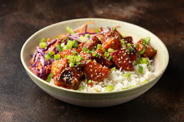Vegan fried tempeh with rice and vegetables. Asian healthy food