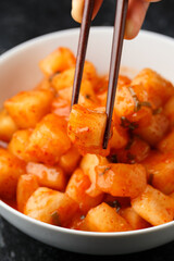 Korean fermented Radish Kimchi in white bowl. Healthy food.