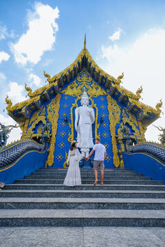 Blue Temple Chiang Rai Thailand, Rong Sua Ten temple, Chiang Rai Blue Temple, or Wat Rong Seua Ten is located in Rong Suea , couple visit a temple in Thailand, man and woman vacation Asia