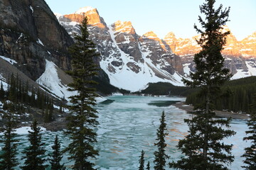 Beautiful morning at sunrise at Moraine Lake. Wonderful road trip through Banff and Jasper national park in British Columbia, Canada. An amazing day in Vancouver. What a beautiful nature in Canada.