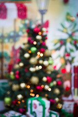 Defocused image of illuminated Christmas tree , Vertical shot
