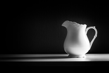 Porcelain jug in black and white. 
