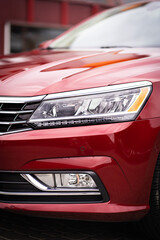 Close up detail on one of the red car taillight modern red crossover car. Exterior detail business...