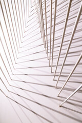 geomtheric abstract lines from pipes on a white background, fragment of an art composition background vertical photo