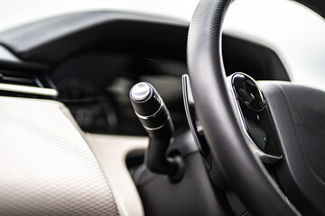 Fototapeta na wymiar Control panel dashboard car fragment. Automatic transmission gear shift in car