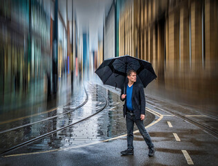 Man with Umbrella in Rainy City