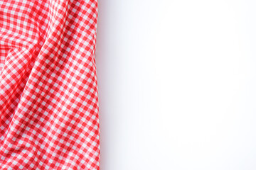 crumple pink plaid fabric or tablecloth on white background with copy space. 