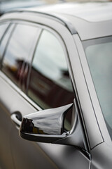 Side car mirror close-up. Details of business car