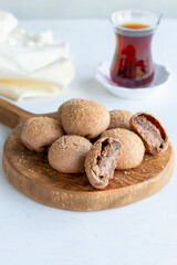 Fig cookies on a white background. Cookies filled with fig marmalade. Close-up. Vertical view