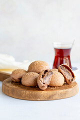 Fig cookies on a white background. Cookies filled with fig marmalade. Close-up. Vertical view
