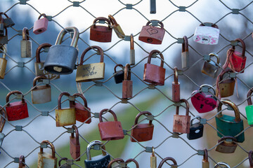 
love padlock or Lucchetti d'Amore, also &bdquo;Liebesschl&ouml;sser&ldquo; in German. Love locks are fitted as a sign of love at bridges, here in Salzburg, Austria.
