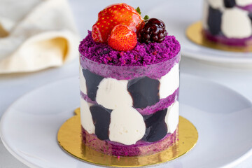 Forest fruit mini cake on a white background. Close-up. Horizontal view