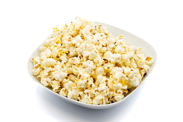 Popcorn on a white background. Fresh popcorn in ceramic bowl. Close-up. Horizontal view