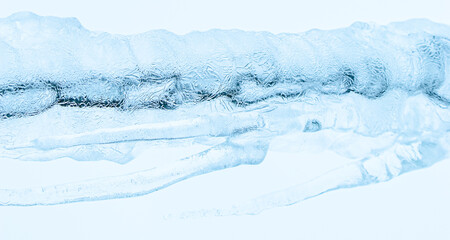 Abstract ice texture. Frozen crystals and icicles on white background. Strong frost in winter.